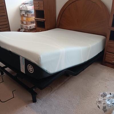 QUEEN SEALY EASE POWER ADJUSTABLE BED WITH CLEAN TEMPURPEDIC MATTRESS, LIGHTED BASSETT HEADBOARD AND WALL UNIT PLUS HANDMADE QUILT AND...