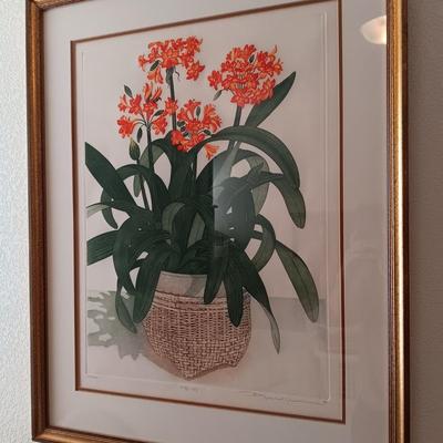 SIGNED AND NUMBERED PICTURE OF KAFFIR LILY AND A WICKER ARM CHAIR