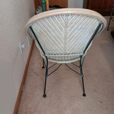 SIGNED AND NUMBERED PICTURE OF KAFFIR LILY AND A WICKER ARM CHAIR