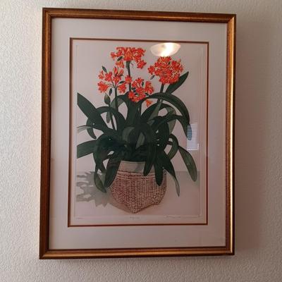 SIGNED AND NUMBERED PICTURE OF KAFFIR LILY AND A WICKER ARM CHAIR