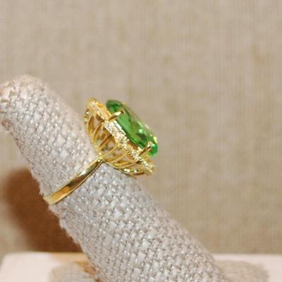 Size 6½ Large Key Lime Green Oval Stone Ring with Surrounds on a Nested Style Setting and Gold Tone Band (5.1g)