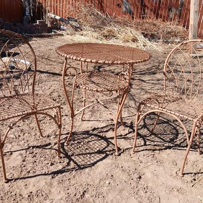 Metal bistro table with two chairs