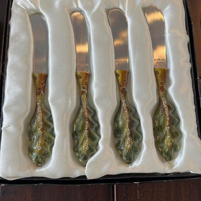 Lot of salad servers, cocktail skewers and cheese knives