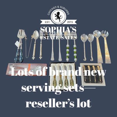 Lot of salad servers, cocktail skewers and cheese knives