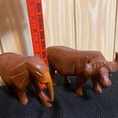 Wood carved elephant and water buffalo