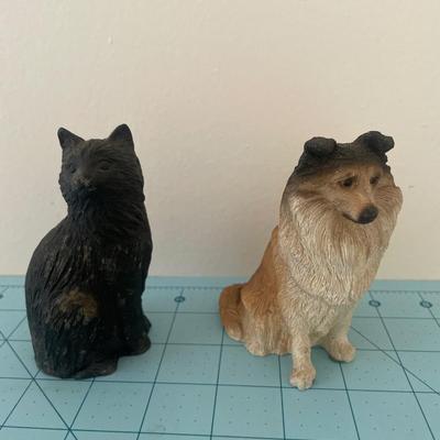 Resin cat and dog statue