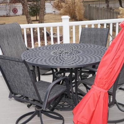 Sale Photo Thumbnail #15: 42" round patio table with four chairs. 
the table is light enough for two people to move around. Not a heavy iron. 
yet it is very durable and of good quality. 
The four chairs of a heavy outdoor fabric . very comfortable. 
the chairs swivel and rock. Ni