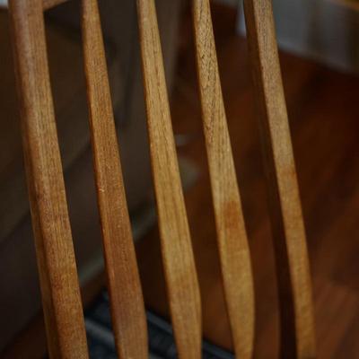 SET OF THREE ARROW BACK TEAK DINING CHAIRS W/ BLACK VINYL SEATS.