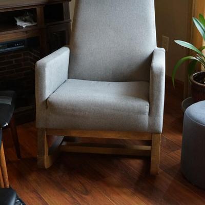 MCM STYLE UPHOLSTERED WITH WOOD BASE ROCKER IN LIGHT GREY FABRIC