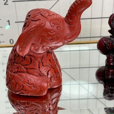 China Handcrafted Carved Red Resin and more Elephants