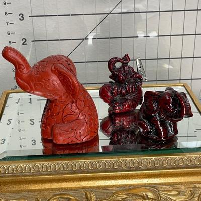 China Handcrafted Carved Red Resin and more Elephants