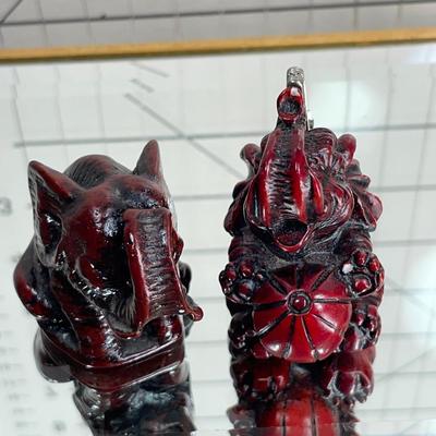 China Handcrafted Carved Red Resin and more Elephants