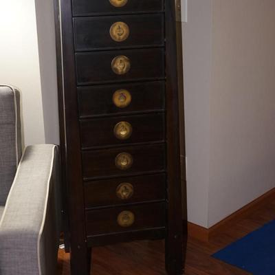 MCM ASIAN INFLUENCE EIGHT DRAWER TALL CHEST/ BRASS PEDAL SHAPED LEAVES AND BACK PLATE