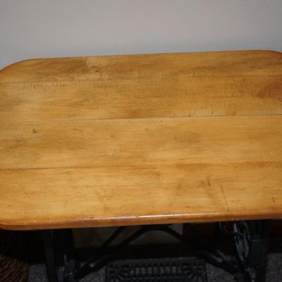 ANTIQUE CAST IRON TREADLE SEWING MACHINE BASE WITH A NATURAL WOOD TOP