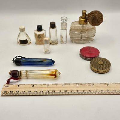 LOT 542: Antique Perfume Bottles, Talc Bottles, Ladies Handkerchiefs, Makeup , Greeting Cards, Face Cream, Face Fan, & Small Bud Vase