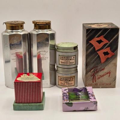LOT 542: Antique Perfume Bottles, Talc Bottles, Ladies Handkerchiefs, Makeup , Greeting Cards, Face Cream, Face Fan, & Small Bud Vase