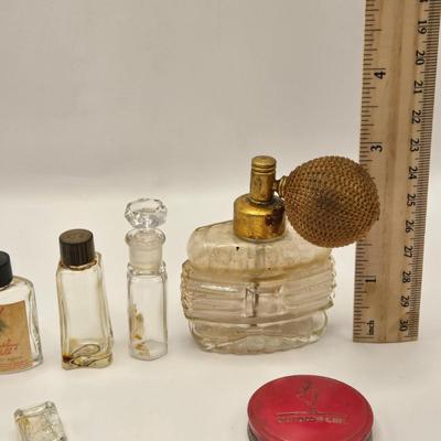 LOT 542: Antique Perfume Bottles, Talc Bottles, Ladies Handkerchiefs, Makeup , Greeting Cards, Face Cream, Face Fan, & Small Bud Vase
