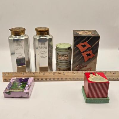 LOT 542: Antique Perfume Bottles, Talc Bottles, Ladies Handkerchiefs, Makeup , Greeting Cards, Face Cream, Face Fan, & Small Bud Vase