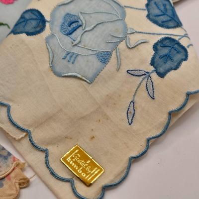 LOT 542: Antique Perfume Bottles, Talc Bottles, Ladies Handkerchiefs, Makeup , Greeting Cards, Face Cream, Face Fan, & Small Bud Vase