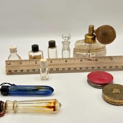 LOT 542: Antique Perfume Bottles, Talc Bottles, Ladies Handkerchiefs, Makeup , Greeting Cards, Face Cream, Face Fan, & Small Bud Vase