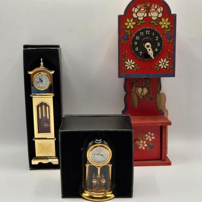 LOT 546: Vintage German Wooden Miniature Grandfather Clock, Miniature Gold Tone Grandfather Clock, & Miniature Gold Tone Mantle Clock