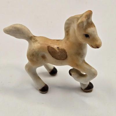 LOT 553: Miniatures of All Sorts, Including Musical Instrument Playing Monkeys, Salt & Pepper Shakers, Vase, Pitcher, & Kodak...