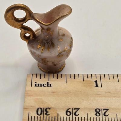 LOT 553: Miniatures of All Sorts, Including Musical Instrument Playing Monkeys, Salt & Pepper Shakers, Vase, Pitcher, & Kodak...