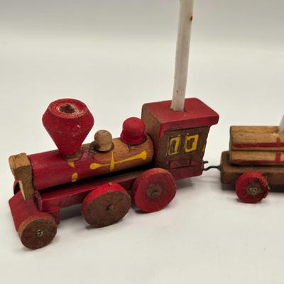 LOT 554: Miniature Wooden Train, Trucks, & Wooden Stamper Set