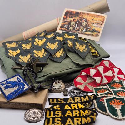 LOT 556: Army Jacket, Multiple Patches, Notice of Recruitment, Metal Pins, Cannon, & Charm, Postcard, & First Aid smelling Salts