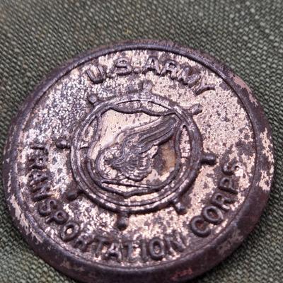 LOT 556: Army Jacket, Multiple Patches, Notice of Recruitment, Metal Pins, Cannon, & Charm, Postcard, & First Aid smelling Salts