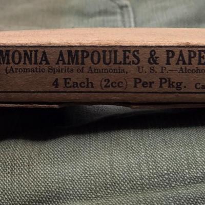 LOT 556: Army Jacket, Multiple Patches, Notice of Recruitment, Metal Pins, Cannon, & Charm, Postcard, & First Aid smelling Salts