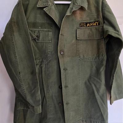 LOT 556: Army Jacket, Multiple Patches, Notice of Recruitment, Metal Pins, Cannon, & Charm, Postcard, & First Aid smelling Salts