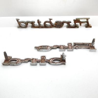 LOT 560: Vintage El Camino Camper Car, Metal Firebird Car Badge / Emblem, Mercury Key with Key Holder and More