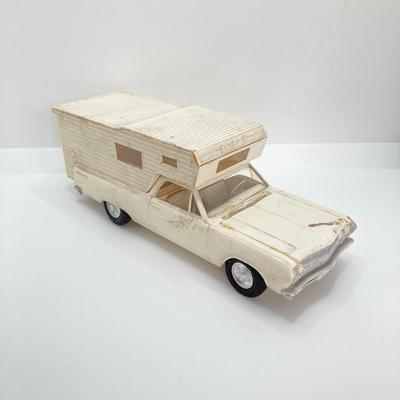 LOT 560: Vintage El Camino Camper Car, Metal Firebird Car Badge / Emblem, Mercury Key with Key Holder and More