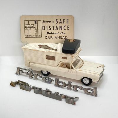 LOT 560: Vintage El Camino Camper Car, Metal Firebird Car Badge / Emblem, Mercury Key with Key Holder and More