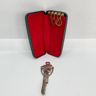 LOT 560: Vintage El Camino Camper Car, Metal Firebird Car Badge / Emblem, Mercury Key with Key Holder and More