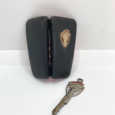 LOT 560: Vintage El Camino Camper Car, Metal Firebird Car Badge / Emblem, Mercury Key with Key Holder and More