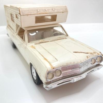LOT 560: Vintage El Camino Camper Car, Metal Firebird Car Badge / Emblem, Mercury Key with Key Holder and More