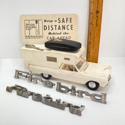LOT 560: Vintage El Camino Camper Car, Metal Firebird Car Badge / Emblem, Mercury Key with Key Holder and More