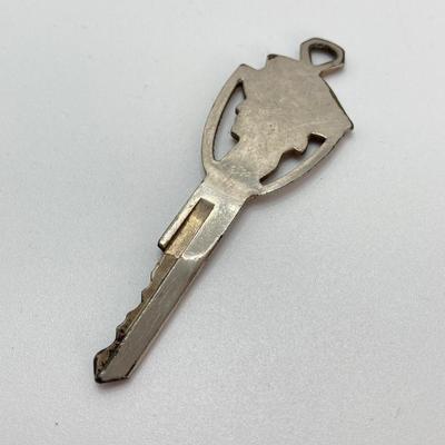 LOT 560: Vintage El Camino Camper Car, Metal Firebird Car Badge / Emblem, Mercury Key with Key Holder and More