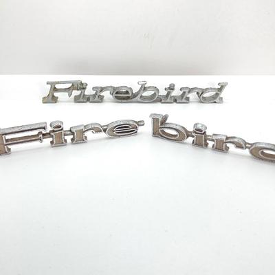 LOT 560: Vintage El Camino Camper Car, Metal Firebird Car Badge / Emblem, Mercury Key with Key Holder and More