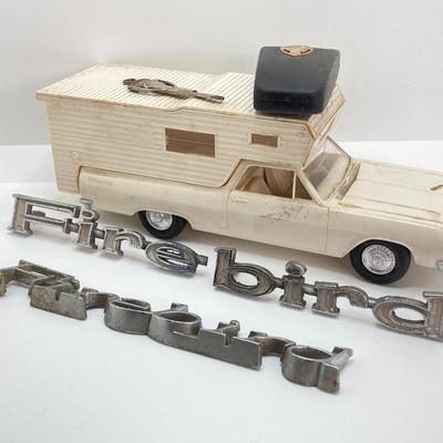 LOT 560: Vintage El Camino Camper Car, Metal Firebird Car Badge / Emblem, Mercury Key with Key Holder and More