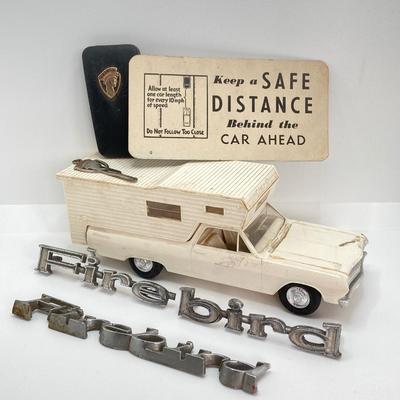 LOT 560: Vintage El Camino Camper Car, Metal Firebird Car Badge / Emblem, Mercury Key with Key Holder and More