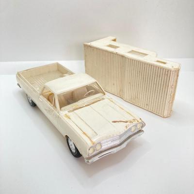 LOT 560: Vintage El Camino Camper Car, Metal Firebird Car Badge / Emblem, Mercury Key with Key Holder and More
