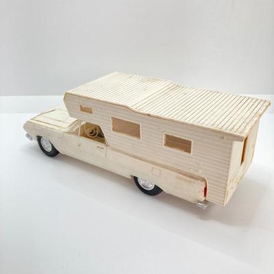 LOT 560: Vintage El Camino Camper Car, Metal Firebird Car Badge / Emblem, Mercury Key with Key Holder and More