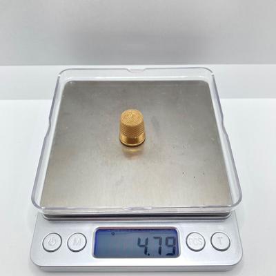 LOT 579: 14KT Gold Thimble - TW 4.79g