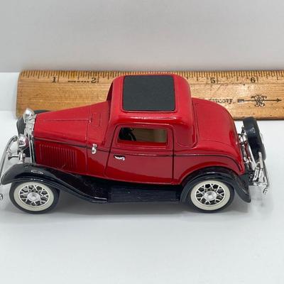 LOT 582: Ford Automobile Collection - Toy Cars, True Value Ertl Bank and Trivet