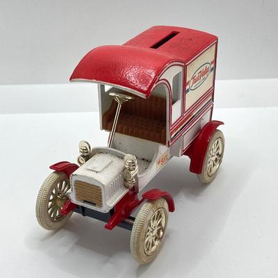 LOT 582: Ford Automobile Collection - Toy Cars, True Value Ertl Bank and Trivet