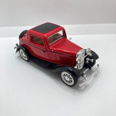 LOT 582: Ford Automobile Collection - Toy Cars, True Value Ertl Bank and Trivet