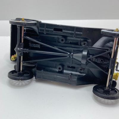 LOT 582: Ford Automobile Collection - Toy Cars, True Value Ertl Bank and Trivet